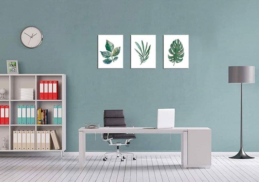 Canvas art as home office wall decor with computer, table, chair, and open cabinet
