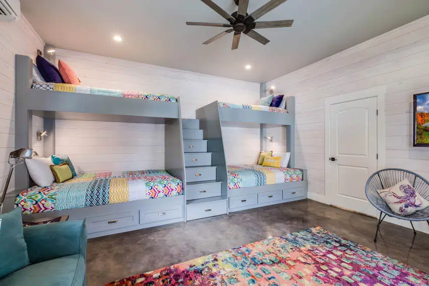 Children's bedroom with bunk beds and brown ceiling fan