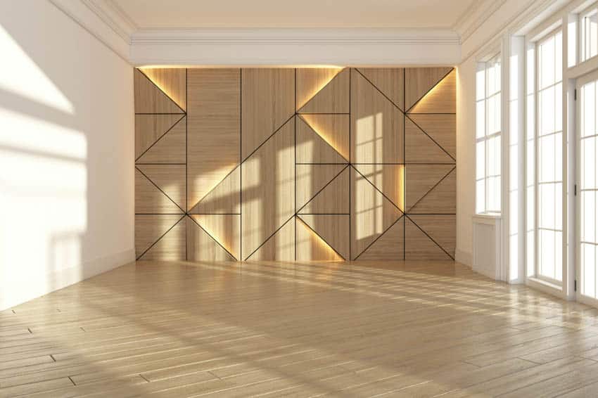 Backlit wall with diagonal shape patterns and white French doors