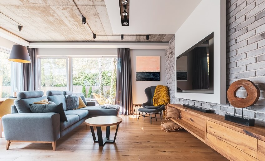 Elegant room, light wooden floor and a mounted tv