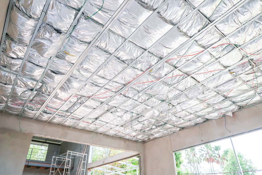 Exposed garage ceiling with foil for insulation