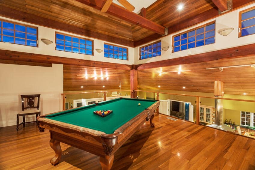 Game entertainment room with wooden flooring, wooden ceiling, and a table for pool