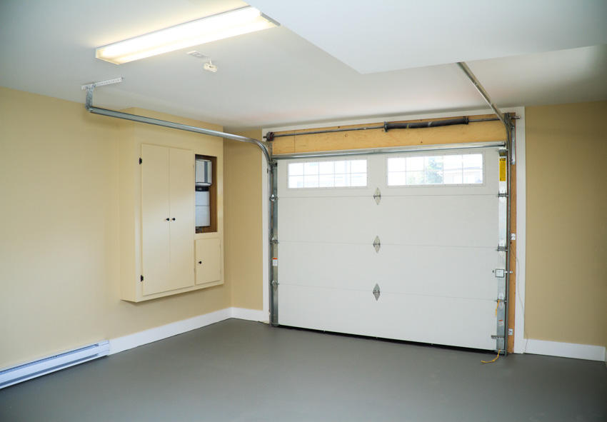 Garage tracked door, floating cabinet and flourescent light