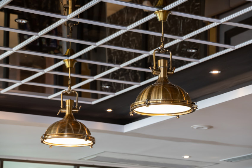 Gold finished light fixtures on a ceiling