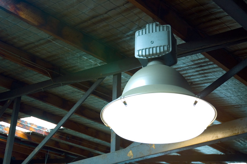 A lighting fixture on exposed ceiling