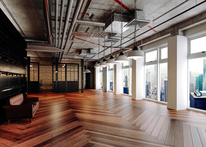 Industrial design apartment with herringbone floor pattern