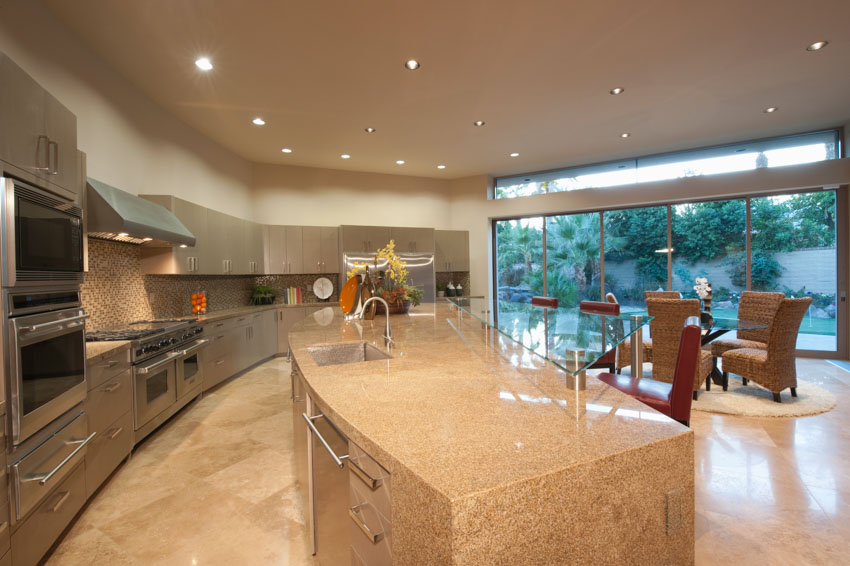 Kitchen with center island, dining set with granite countertop