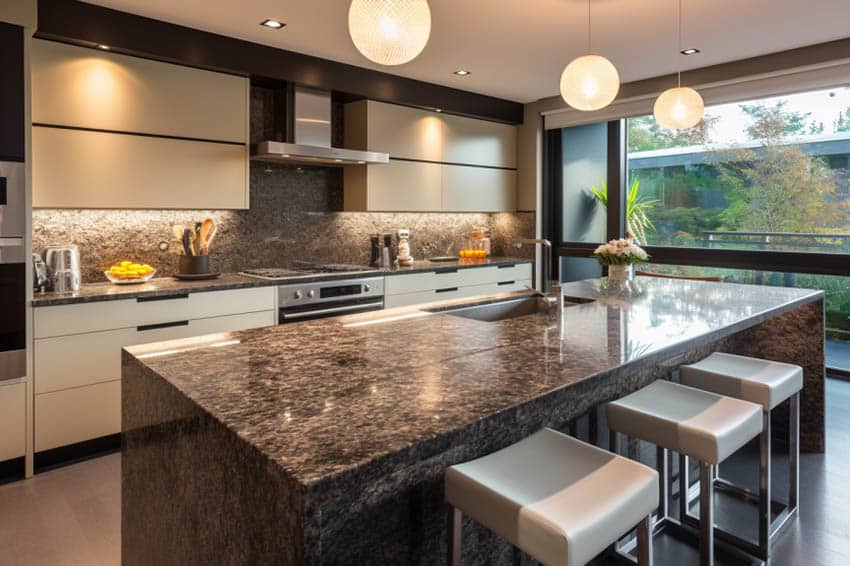 kitchen with black granite and cream cabinets