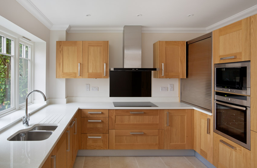 Kitchen With Oak Cabinets White Countertop Hood Backsplash Window Is 