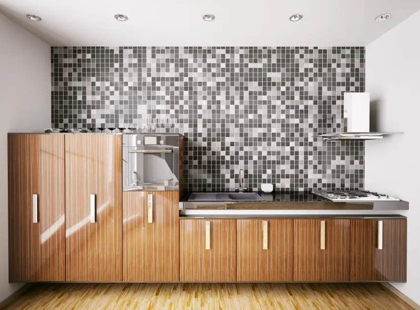 Kitchen with tiled backsplash, and brown cabinets