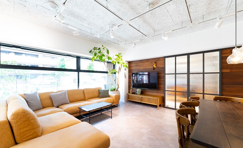 Wood panel walls, tile floors and pendant lights