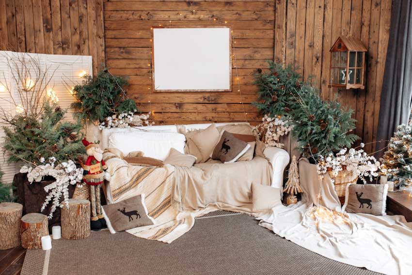 Room with wood pallets, Christmas decor and neutral tone throw blankets