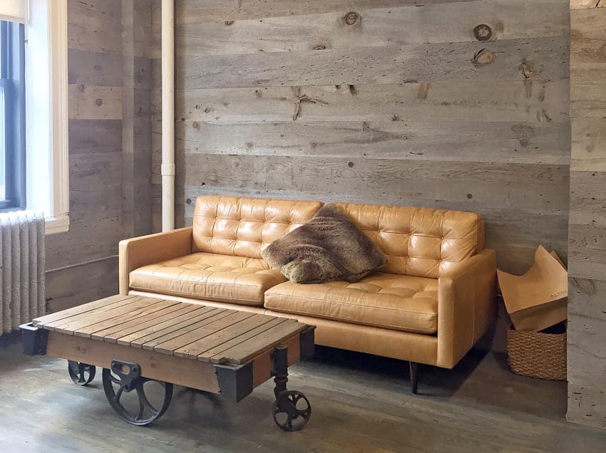 Lounge area with leather couch and wagon like coffee table