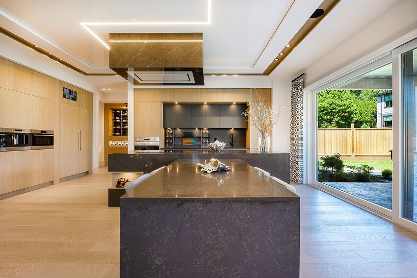 Kitchen with wine storage, LED lights and glass sliding door opening to the patio garden