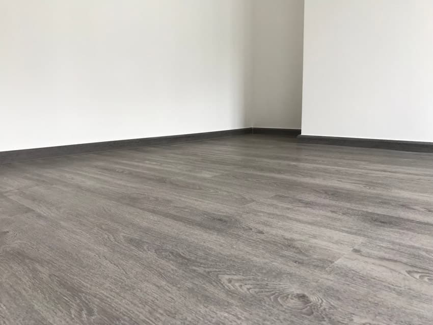 Luxury vinyl floor inside an empty room with white walls