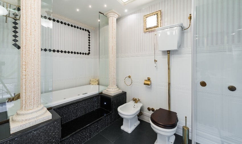 Bathroom with columns tub with black mosaic tiles