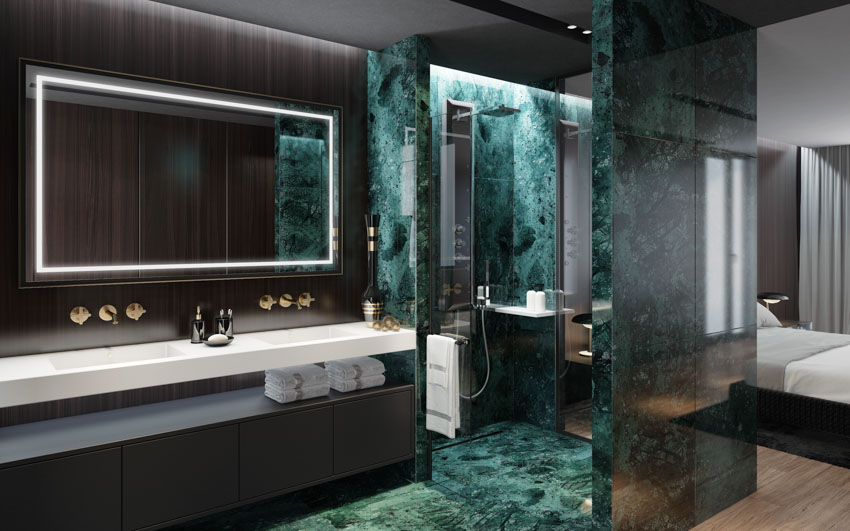 Modern bathroom with green onyx shower, mirror, countertop, and faucet
