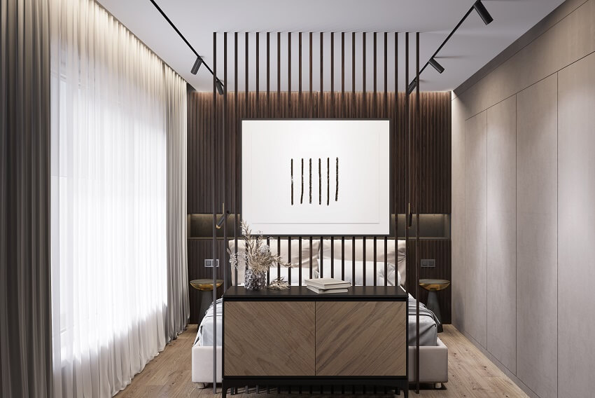 Modern bedroom with a floor to ceiling partition L-type track lighting wooden cabinet bedside tables a beige bed a gray wardrobe and window with curtains
