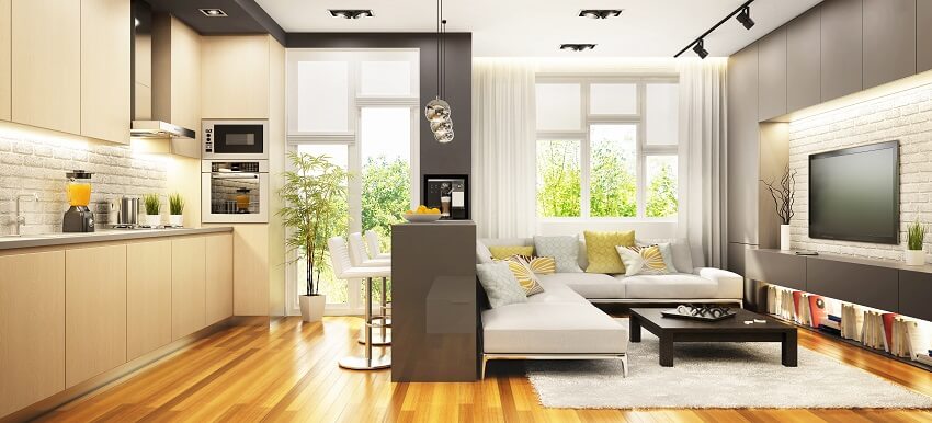 Modern space with white sofa, coffee table and black track light fixtures