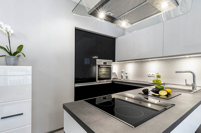 Modern kitchen with black honed granite countertops white cabinets
