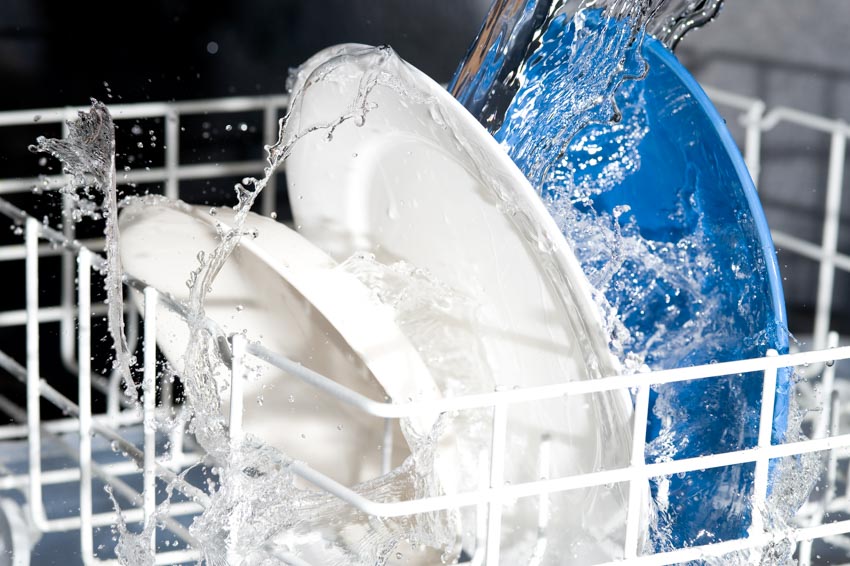 Plates being cleaned inside a dishwasher