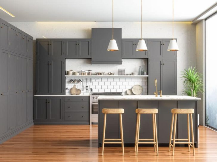 Prefabricated Kitchen With Black Cabinets Center Island Stools Wood Flooring Backsplash And Pendant Lights Is 728x546 