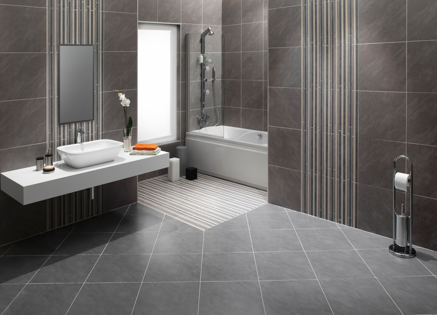 Dark bathroom with floor and wall tile