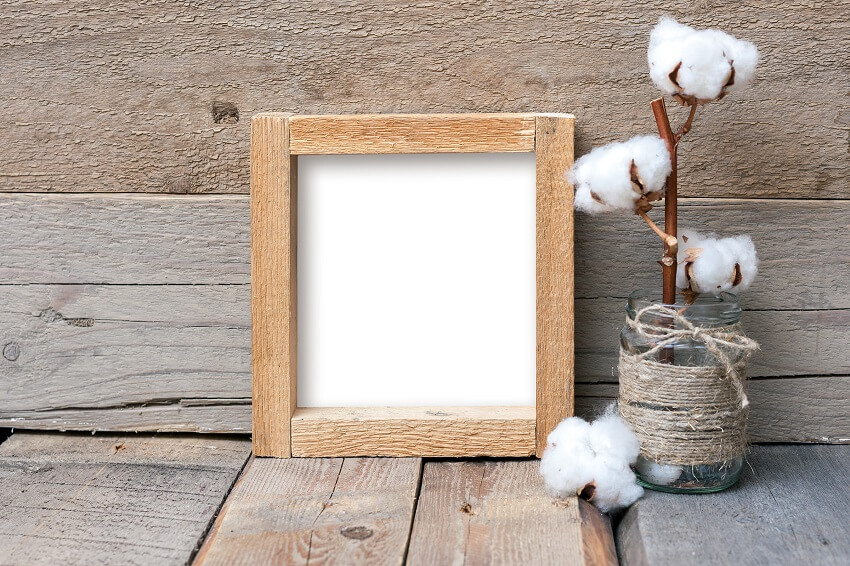 Rustic style rough square frame on a wooden table