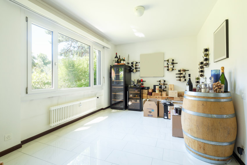 Storage room with barrels wine coolers and windows