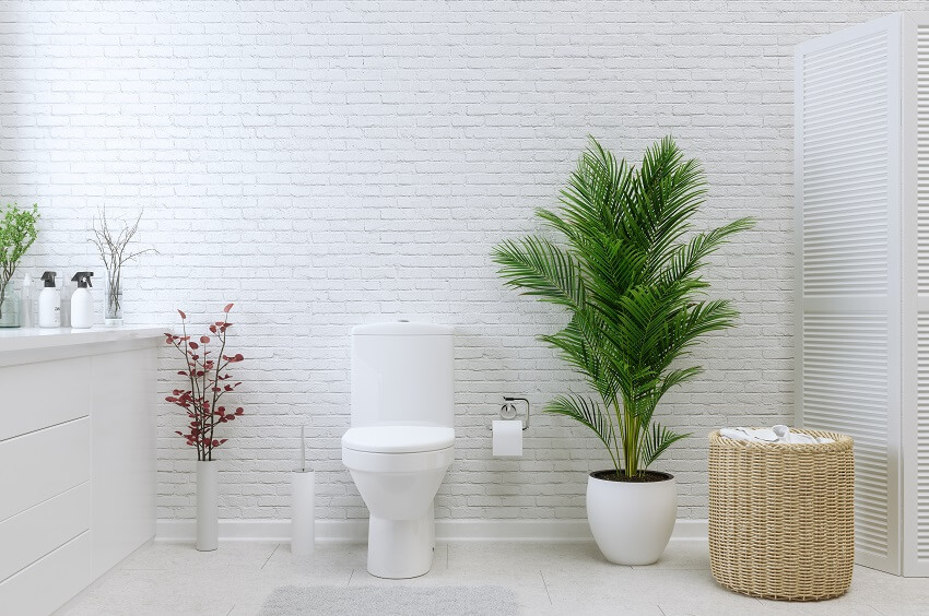 White bathroom with upflush toilet