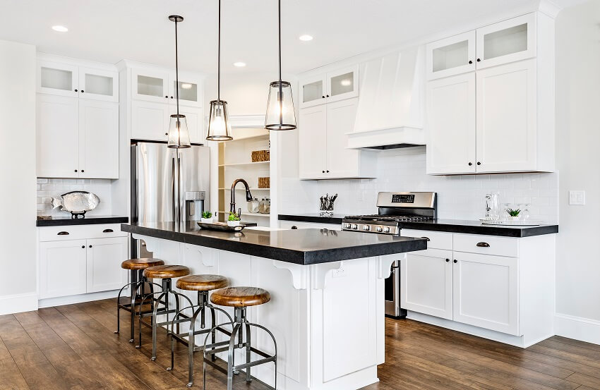 White gourmet kitchen with black surfaces