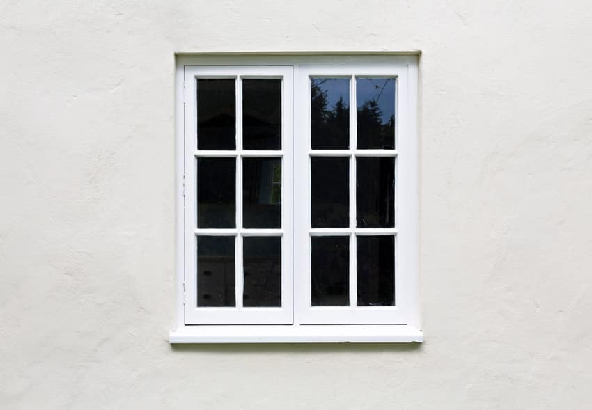 White house exterior with casement windows