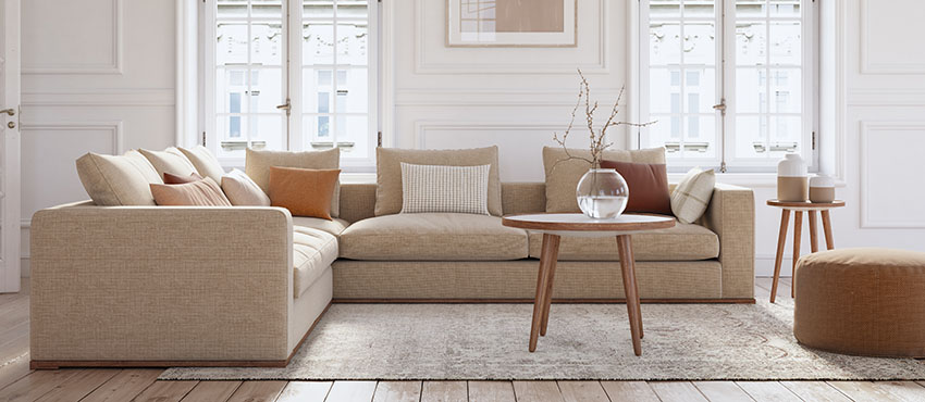 Contemporary living room with sectional furniture, wood floors and large windows