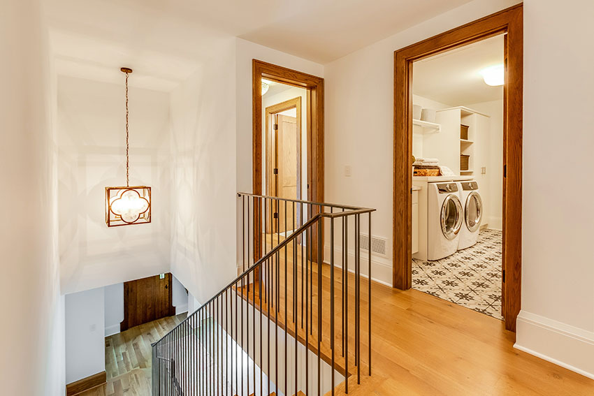 Landing with laundry room with beige paint