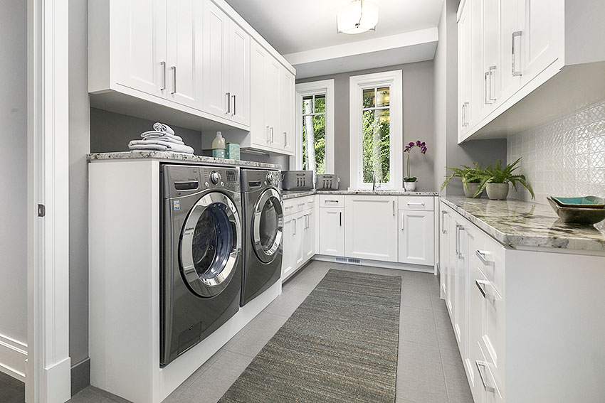 Laundry area with white cabinet gray paint