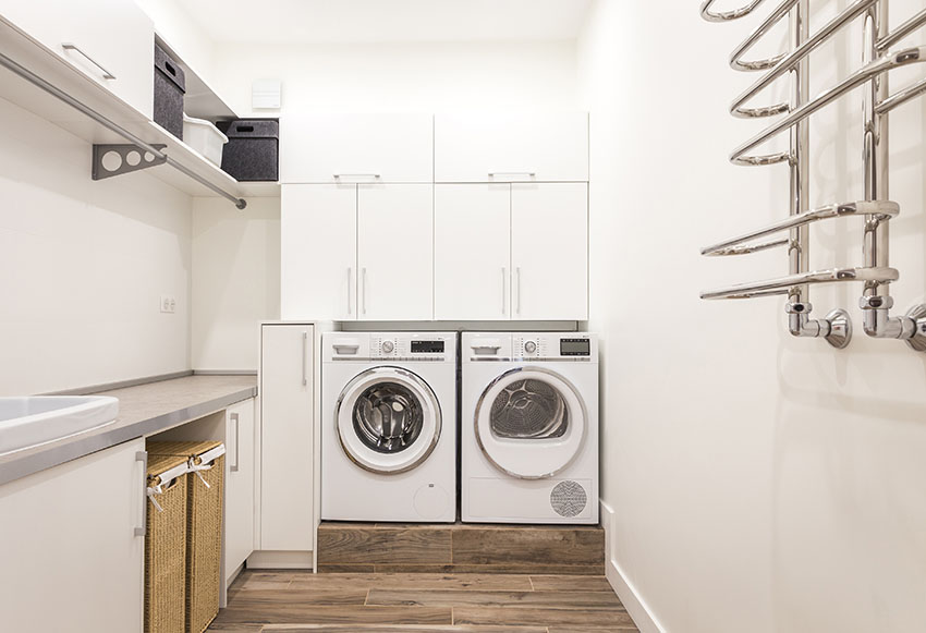 Laundry room with towel hanger white paint hanging cabinets