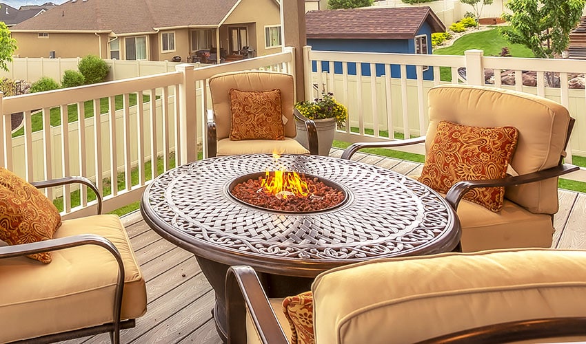 Porch fire pit table with chairs with cushions