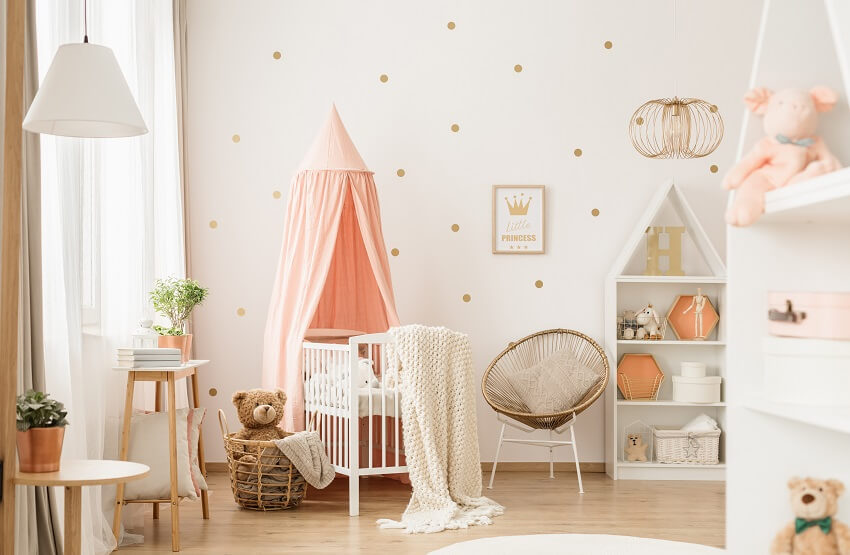 Baby's room interior with lamp, canopied cradle, papasan chair, and wallpaper