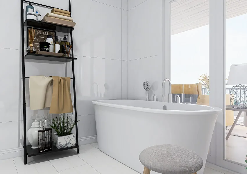 Bathroom with bathtub, stool, and shelves with decor
