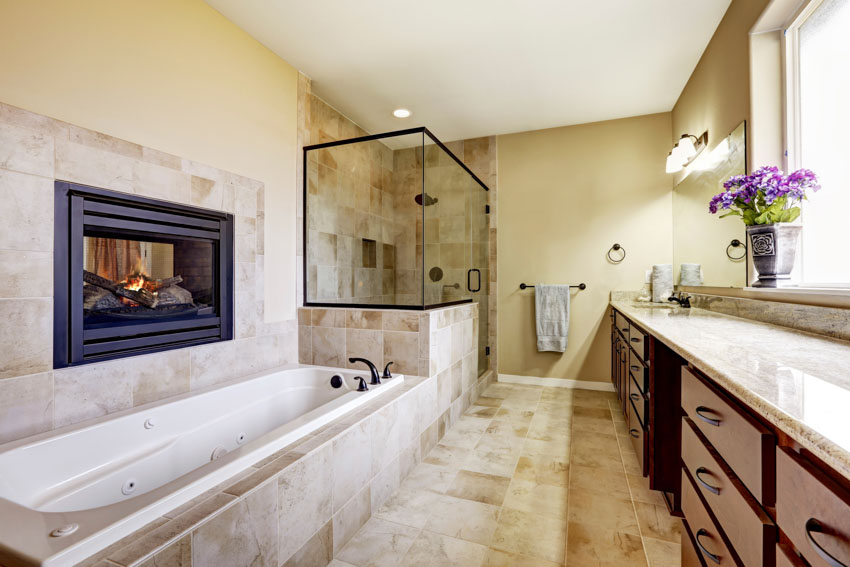 Bathroom with fireplace and matching tile flooring
