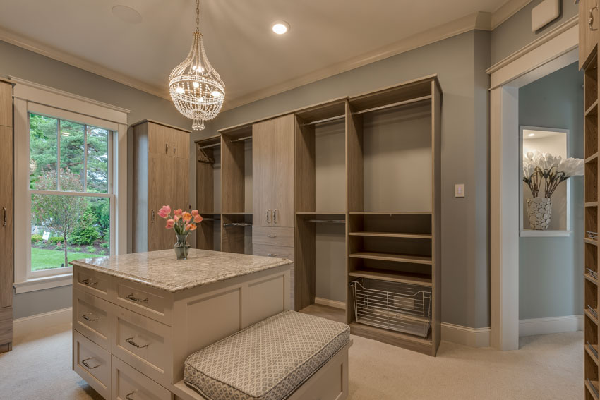 Blue gray walls matched with light ash wood for cabinets and carpet floors