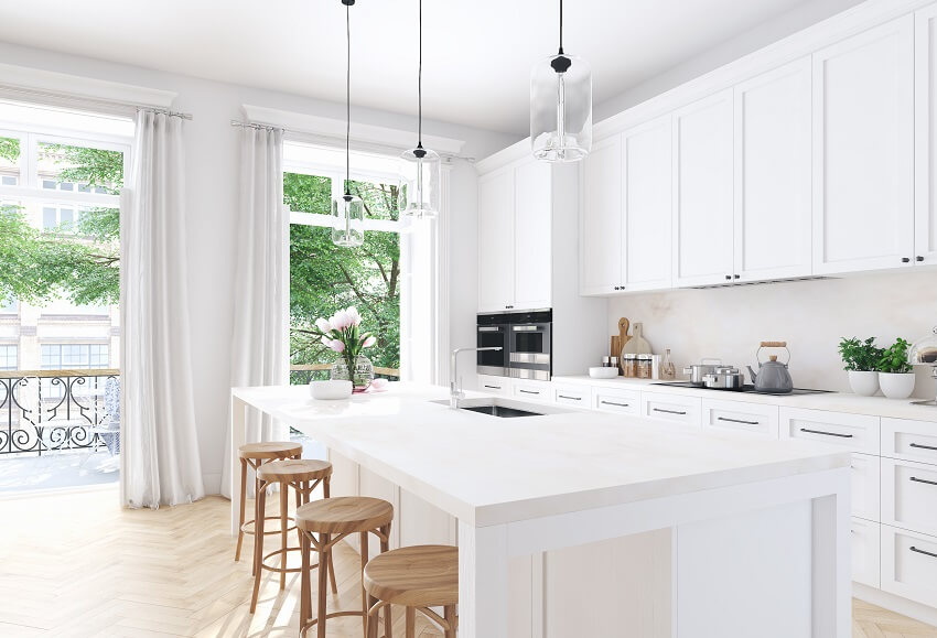 Bright apartment kitchen with white curtains