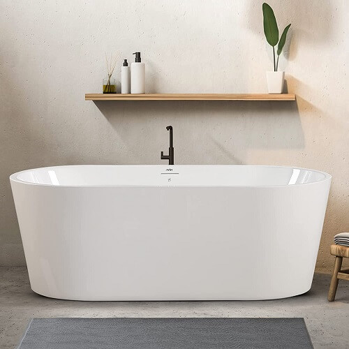 Classic oval shape acrylic bathtub under a wood floating shelf