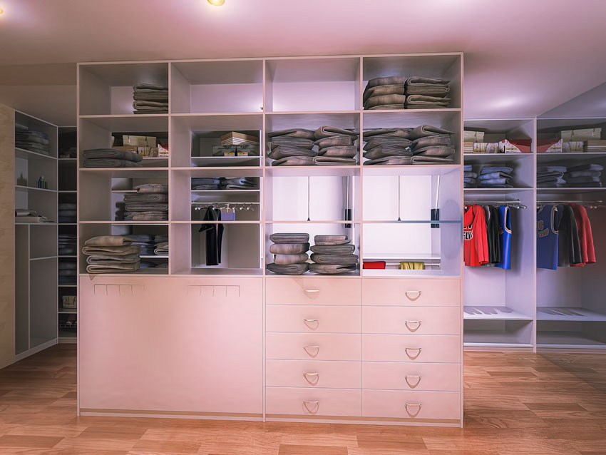Closet with center island storage, wood floor, and open cabinets