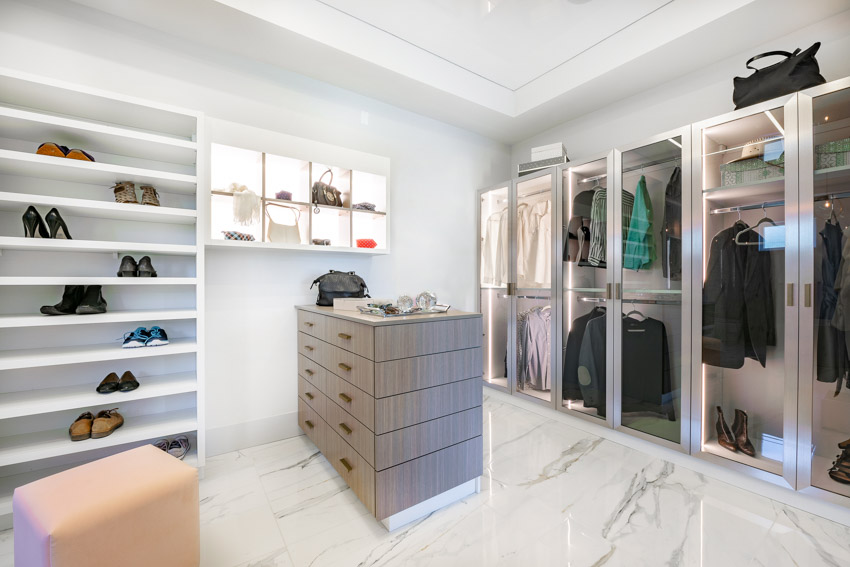 Closet with storage, drawers, and cabinets