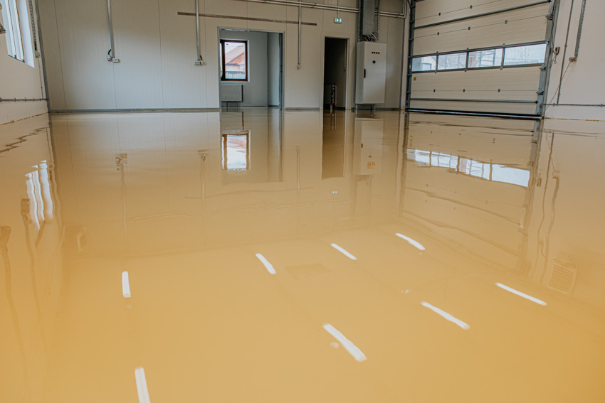 Garage with yellow epoxy floor and door