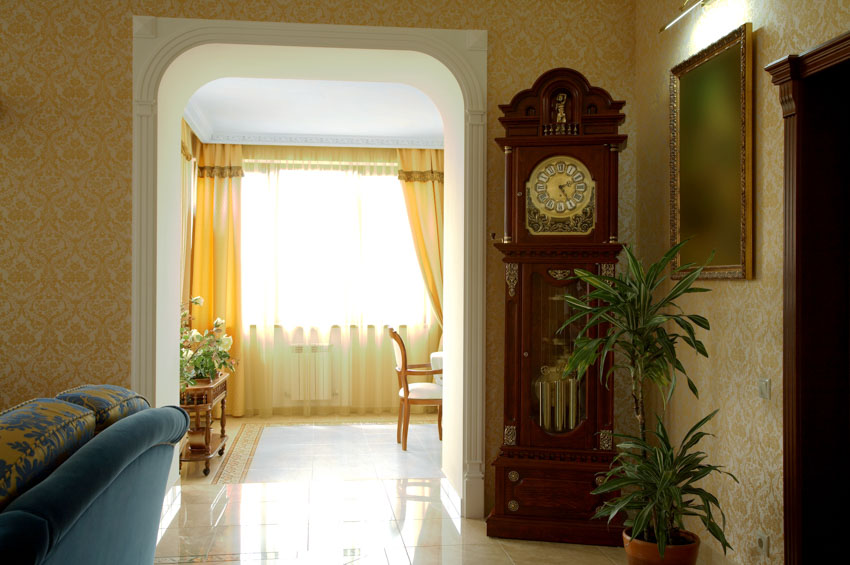 Room with vintage clock and curtains