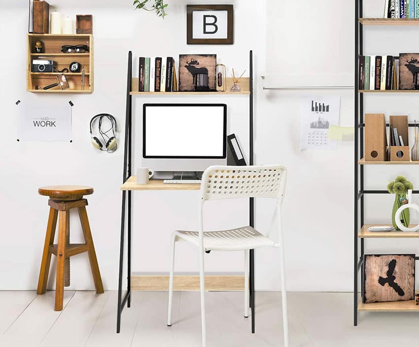 Home office with ladder type of desk, chair, computer, and decor