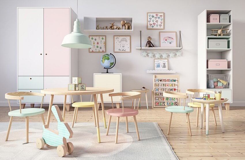 Kid's playroom with pastel colored wood chairs, grey walls, open shelves, and cabinets
