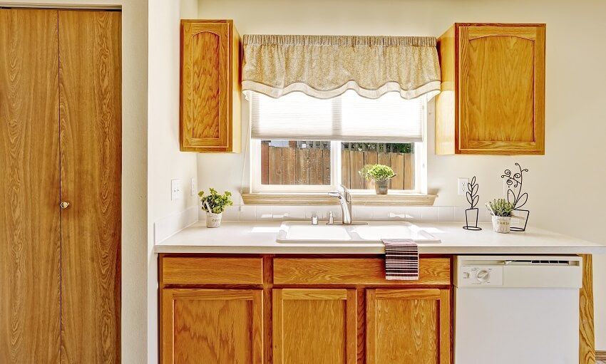 Kitchen with window by the sink with valance curtain